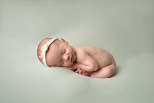 when should I book a newborn photographer?